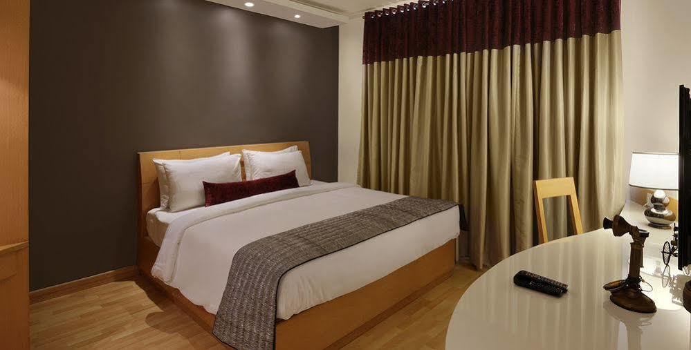 Melange Luxury Service Apartment Бангалор Екстериор снимка